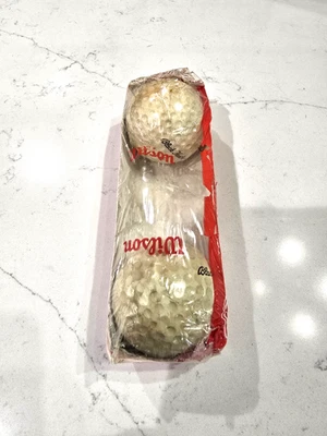 VINTAGE 1961 WILSON BLACK HEATHER GOLF BALL SLEEVE WITH TWO BALLS - Image 1 of 4