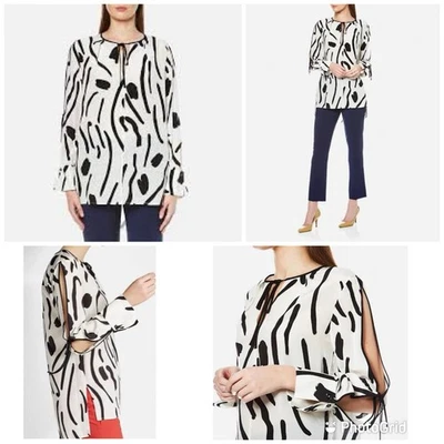 Blusa Diane Von Fürstenberg atada con ojo de cerradura blanca 100 % seda manga larga. Precio de venta sugerido por el fabricante $298 Foto 1 de 4