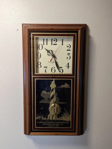 CAPE HATTERAS LIGHTHOUSE PAINTED GLASS PENDULUM WALL CLOCK, HANOVER QUARTZ, NC Cover