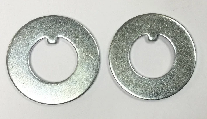 TAB WASHER FOR FRONT AXLE (PAIR). COMPATIBLE WITH: MASSEY FERGSON & FORD