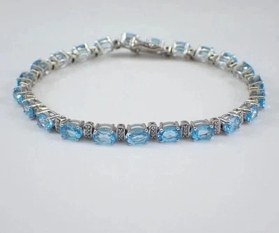 Brazalete de tenis para mujer de topacio azul ovalado de 10 quilates enchapado en oro blanco de 14 quilates Foto 1 de 4