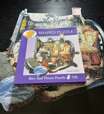 A Stitch In Time Sewing machine Shaped Jigsaw Puzzle 750 Piece By Russell Cobane - Image 1 of 4