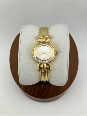 "Reloj de colección Avon para damas 22 mm tono dorado detalles de arco piedras flotantes blancas 6"" - FUNCIONA" Foto 1 de 4