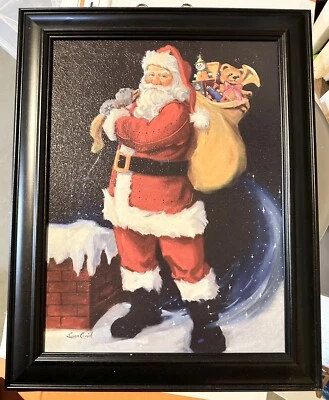 Santa Chimney w/toys Framed Picture Susan Comish 14” X 19” Black frame - Image 1 of 4