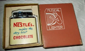 OLD ORIGINAL UNFIRED NOS MUSICAL NESTLE'S CHOCOLATE LIGHTER - Picture 1 of 2