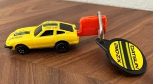 Datsun 280-ZX 1980 Kidco Burnin' Key Car Vintage Yellow with Key/Keyring 1/64 - Picture 1 of 4
