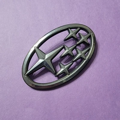 Bin12 1989-1993 Subaru Legacy maletero trasero escotilla estrella logotipo emblema OEM 93060AA060 Foto 1 de 3
