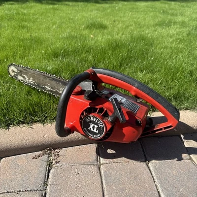 Motosserra vintage Homelite XL lubrificação automática com barra de 14 pol. 🌟 FUNCIONA MUITO BEM! - Imagem 1 de 4