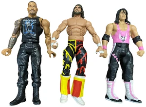 Lot of 3 WWE Wrestling Figures  Randy Savage  Bret Hart & Roman Reigns - Picture 1 of 2