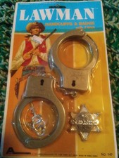 1978 - Never Opened - Lawman plastic toy handcuffs w/ sheriff badge - Arco toys
