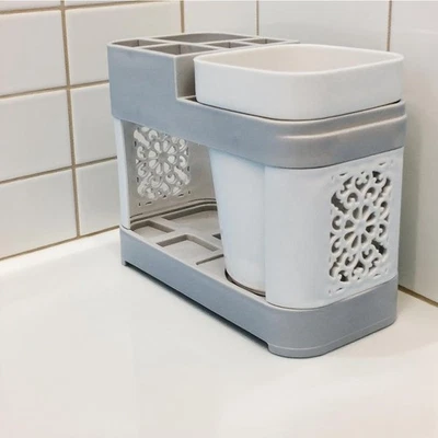 Soporte para pasta de dientes para cepillo de dientes plástico resistente higiénico organización para baño Foto 1 de 4