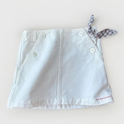 Falda de algodón blanca Burberry para niñas talla 4 panel de botones cintura ajustable preppy Foto 1 de 4