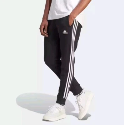 Pantalones deportivos Adidas para hombre grandes esenciales de vellón con puño cónico nuevos Foto 1 de 4