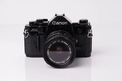 Cámara Canon A-1 35 mm película SLR + lente Canon FD 28-55 mm f/3,5-4,5 - probada y funciona Foto 1 de 4