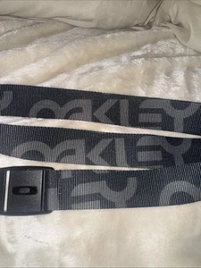 Nuevo sin etiquetas Cinturón Oakley Nylon Tejido Poliéster Ajustable Negro Gris Factory Lite Para Hombres S - Imagen 1 de 13
