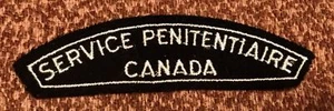 A vintage CANADA SERVICE PENITENTIAIRE cloth shoulder title. B4 - Picture 1 of 2