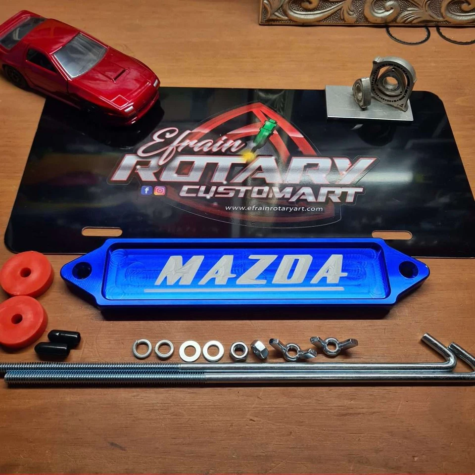 Retención de batería - Mazda - azul Foto 1 de 1