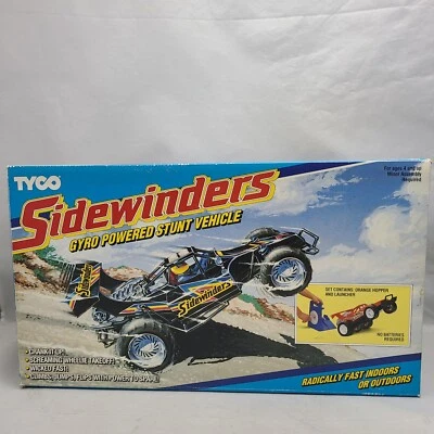 TYCO 1990 GIROSCOPIO MOTORIZADO SIDEWINDERS TOLVA NARANJA CON LANZADOR Nueva Caja Abierta Foto 1 de 4