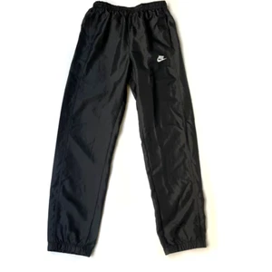 Pantalones de fútbol Nike Windrunner de nailon forrados negros unisex juveniles talla XL - Imagen 1 de 15