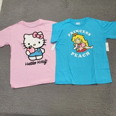 NUEVO CON ETIQUETAS Camiseta Hello Kitty & Super Mario Princesa Melocotón Manga Corta Niños XL (14/16) Foto 1 de 4