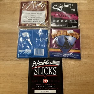 A set of guitar strings from 5 packages . - Picture 1 of 13