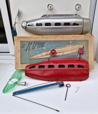 Rare Ballon Dirigeable Le Rapide Aérien jouet ancien tôle en aluminium en boite - Photo 1/4