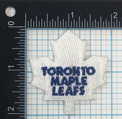 TORONTO MAPLE LEAFS NHL HOCKEY VINTAGE 2" WHITE LEAF BLUE TEXT TEAM PATCH - Image 1 of 3