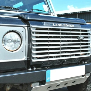 PARRILLA DELANTERA LAND ROVER DEFENDER Y FAROS ENVOLVENTES EN PLATA INDUS DA1257 - Imagen 1 de 2