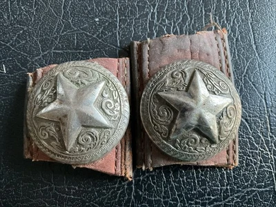 A silver-toned metal concho with a Texas star design on leather. - Image 1 of 4