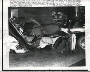 1957 Press Photo Automobile torn apart by giant oil truck