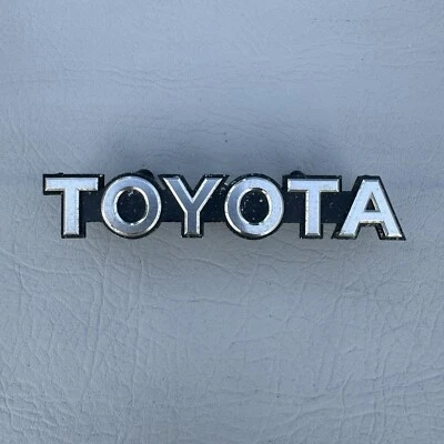 Toyota Camry 1984-1986 radiador delantero parrilla emblema insignia logotipo 75311-39195 OEM Foto 1 de 4