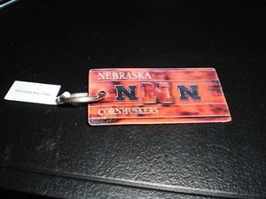  Lot Of 4   Nebraska Cornhuskers Keychain NCAA Team Logo  Printed Key Ring - Picture 1 of 1