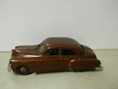 Vintage 1951 Pontiac Eight Metal Toy Wind Up Car Root Beer Brown - Image 1 of 4