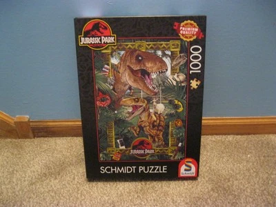 SCHMIDT 1000 PIECE PUZZLE JURASSIC PARK: THE ERA OF THE DINOSAURS CHECK FALL PZL - Image 1 of 4