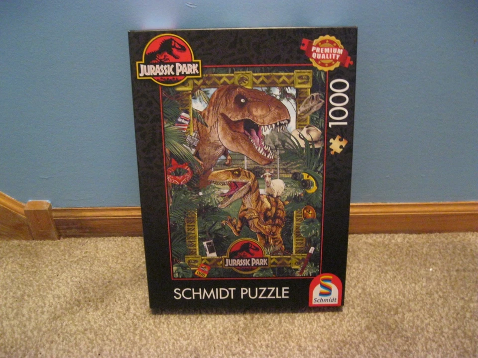 SCHMIDT 1000 PIECE PUZZLE JURASSIC PARK: THE ERA OF THE DINOSAURS CHECK FALL PZL - Image 1 of 4