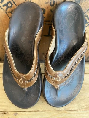 Sandalias de cuero Olukai Mea Ola para hombre 8 tangas sin cordones marrón Java 10138-3448 Foto 1 de 4