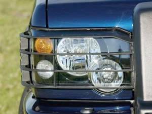 LAND ROVER DISCOVERY 2 TD5 / V8 FACELIFT HEAD LIGHT GUARD SET STC53193 - Picture 1 of 2
