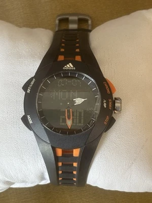 Adidas Reloj Hombre Analógico y Digital 41mm Cara Negra Gris Oscuro y Naranja Correa Foto 1 de 4