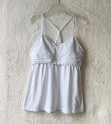 Camiseta sin mangas acolchada Alo Yoga espalda cruzada babydoll marfil para mujer talla pequeña Foto 1 de 4