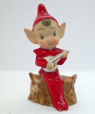 Vintage Japan Pixie Elf on Log Figurine holding instrument 3-5/8"