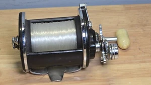 Carrete de pesca convencional Penn 155 de colección nivel viento agua salada EE. UU. funciona limpio - Imagen 1 de 11