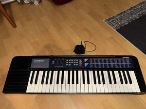 Casio CA-110 Keyboard mit Holz-Keyboardständer Schwarz Pulse Code - Bild 1 von 4