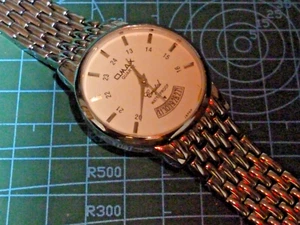 MEN'S OMAX CRYSTAL WATCH STAINLESS STEEL CASE & STRAP WORKING GOOD CONDITION - Picture 1 of 5