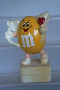 M&M'S RARE FIGURINE BOUCHON CACAHOUETTE JAUNE EN CUPIDON 8 CM DE HAUTEUR 1993 - Picture 1 of 1