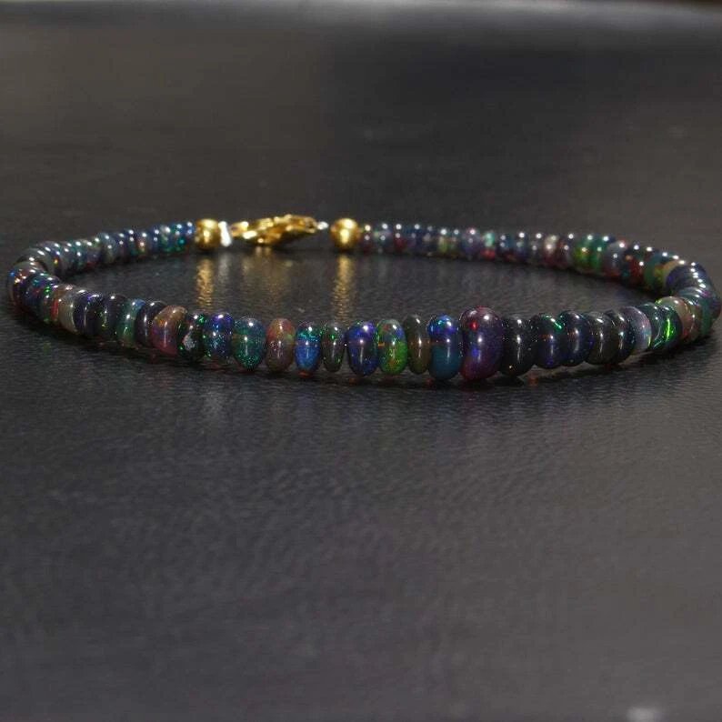 Brazalete de piedras preciosas con cuentas rondelle lisas de ópalo de fuego negro etíope natural de 3-5 mm Foto 1 de 4