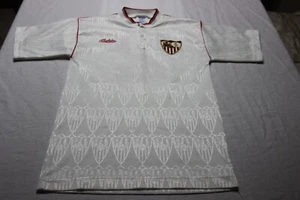 CONJUNTO FUTBOL VINTAGE OFICIAL SEVILLA F.C MARCA BUKTA Nº 2 TALLA NIÑO 40X62 - Imagen 1 de 3