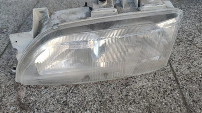 Ford Escort Cosworth ? Scheinwerfer links 91AG13006SLA Carello Laika Ecovip - Bild 1 von 4