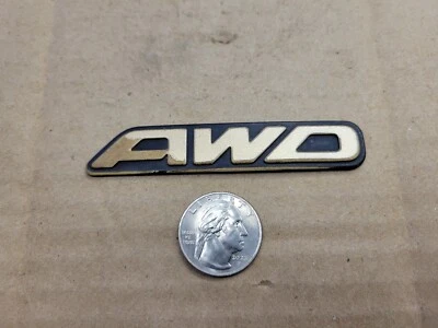 Subaru OEM 2000-2003 Outback Limited "AWD" Gold Rear Trunk Lid Emblem Logo Badge - Image 1 of 3