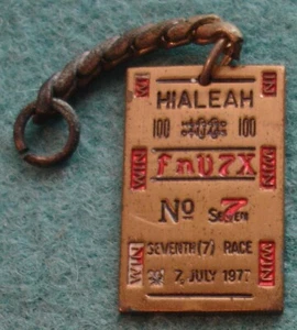 HIALEAH 100 No 7 fnV7X WIN SEVENTH RACE 7 JULY 1977 Good Luck Charm Fob Brass VG - Picture 1 of 2