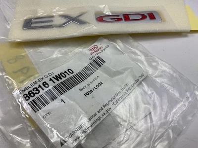 Puerta levadiza trasera emblema puerta trasera "EX GDI" OEM para Kia Rio 2012-17 863161W010 Foto 1 de 3